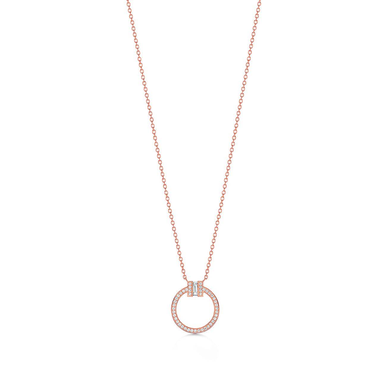 T*f*ny t diamond pendant in 18k rose gold with a baguette diamond