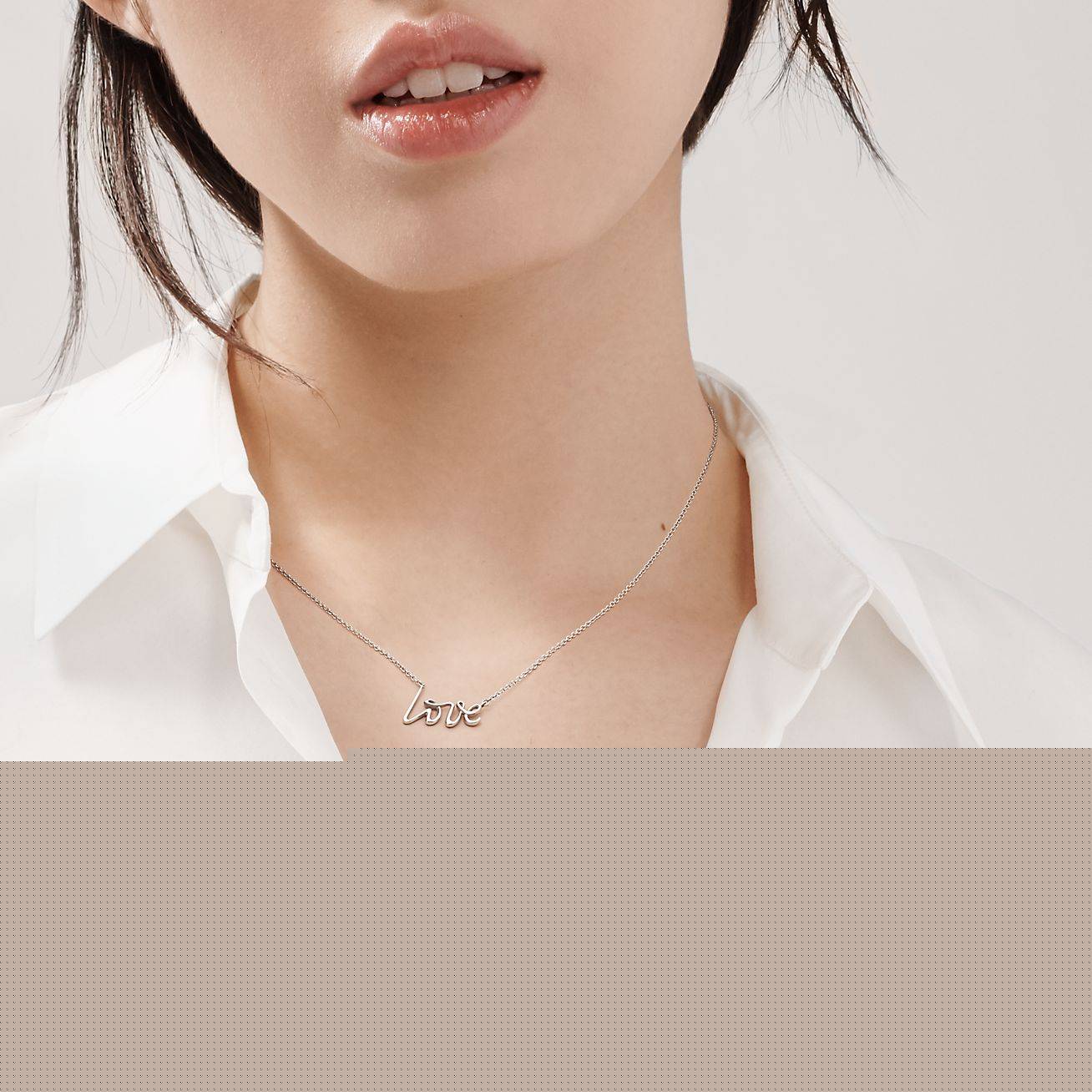 T*f*ny  palomas graffiti love pendant
